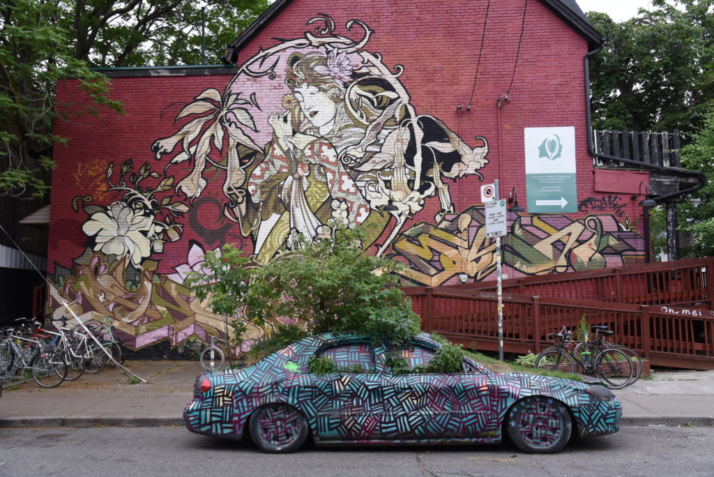 Jugendstil inspired graffiti with painted car in front of it